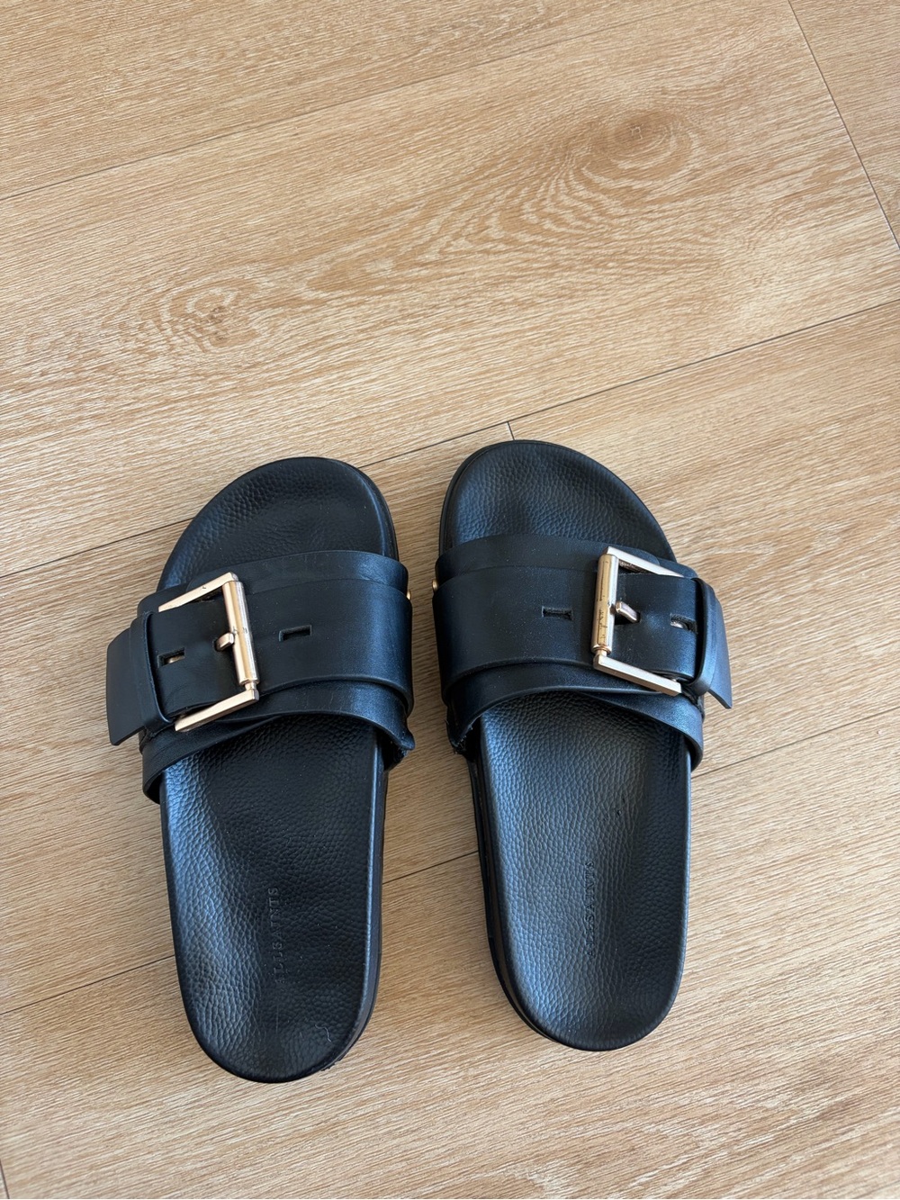 All Saints Black Slide Sandals with Gold Buckle